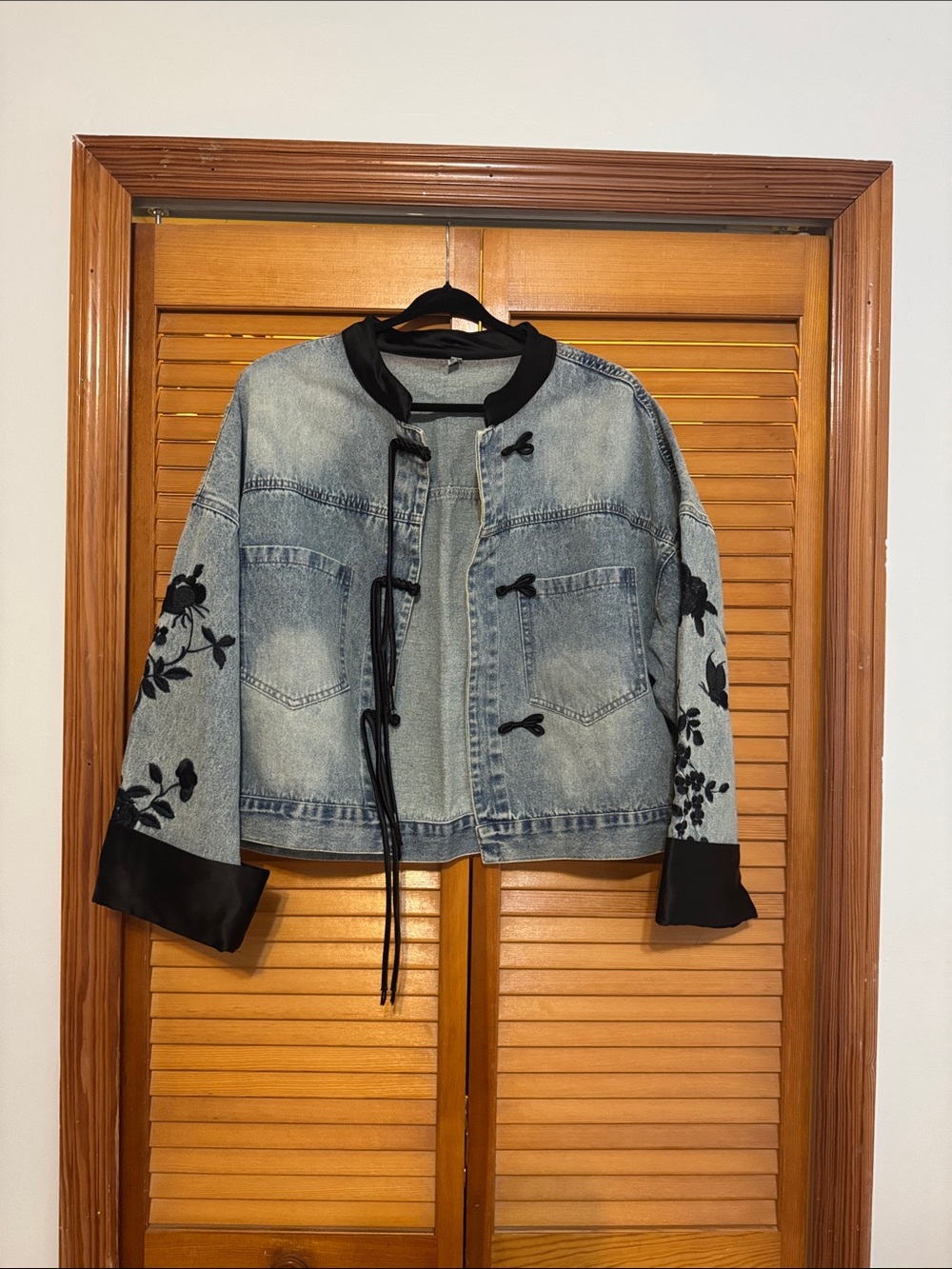 Embroidered Light Wash Denim Jacket with Black Trim